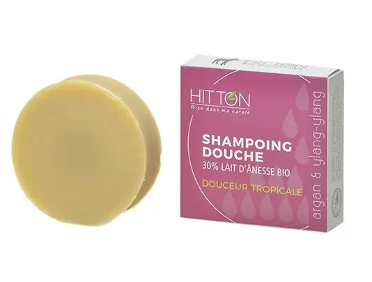 shampoing solide au lait anesse bio pain rond 110g sorti de son emballage rose pour cheveux secs sur fond blanc