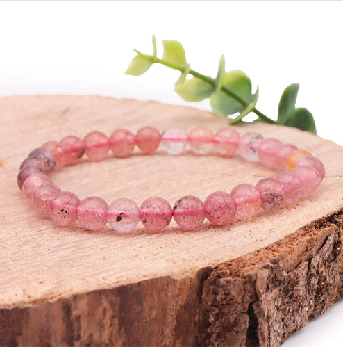 quartz hématoide 06mm qualité AA belle transparence rose un peu tacheté c'est un mélange de quartz rose et de cristal de roche