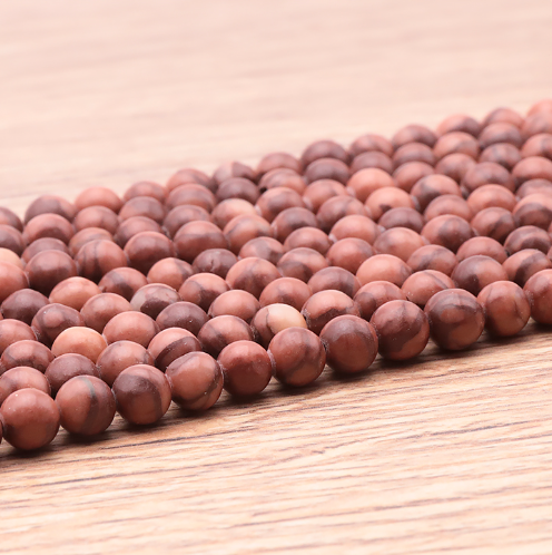 bracelet bois fossile 06mm qualité A pierre naturelle au nuance de rouge clair et foncé